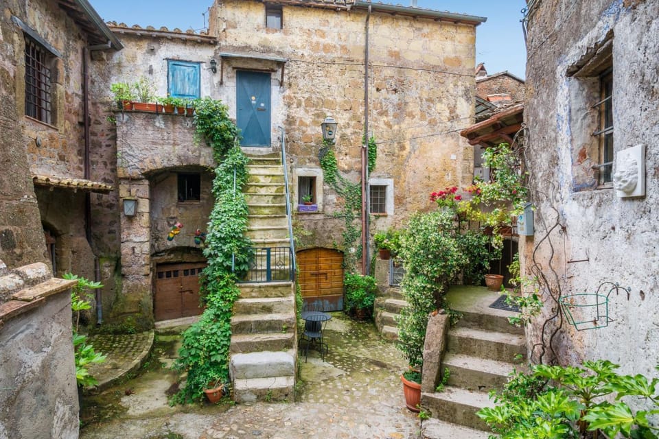 From Rome: Bracciano Lake & Calcata Day Trip, Wines & Lunch - Lake Bracciano and Orsini Castle: the scenery that makes the drive worth it