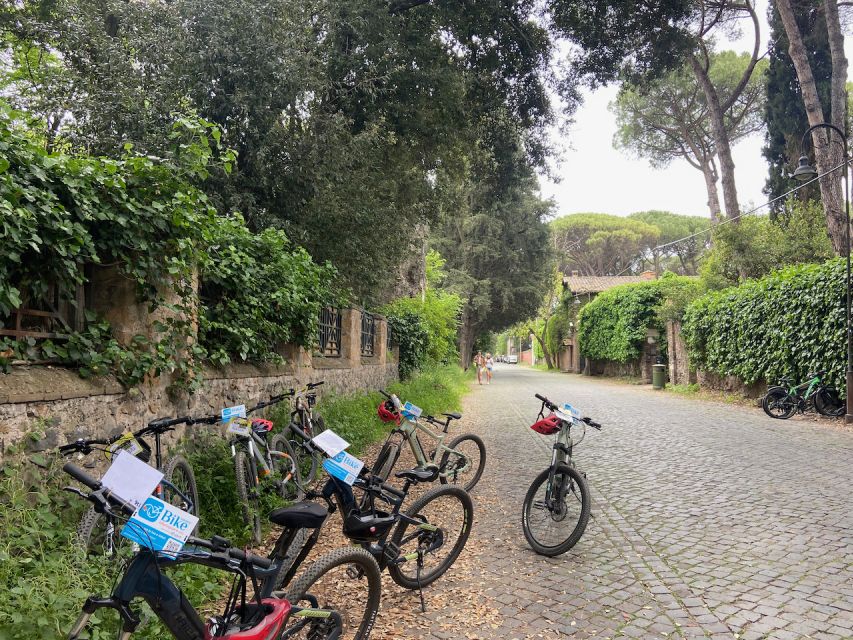 Rome: Appian Way Guided Tour on E-Bike with italian Aperitif - Appia Antica Archaeological Park: walking on the old paving stones