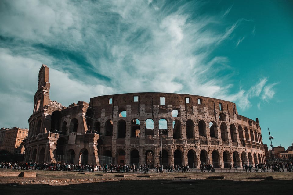 Rome: Colosseum, Forum, Palatine with Breakfast or Aperitif - Entering the Colosseum: the amphitheater scale you can’t fake